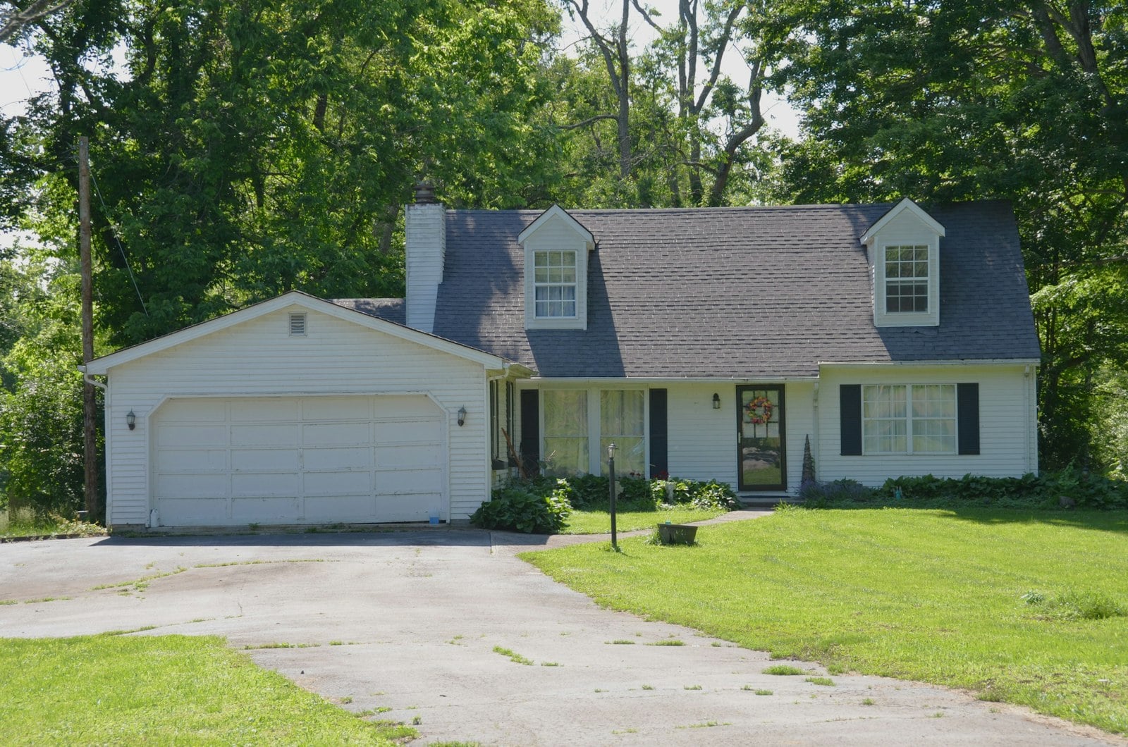 Suburban home with a two-car garage and landscaped driveway